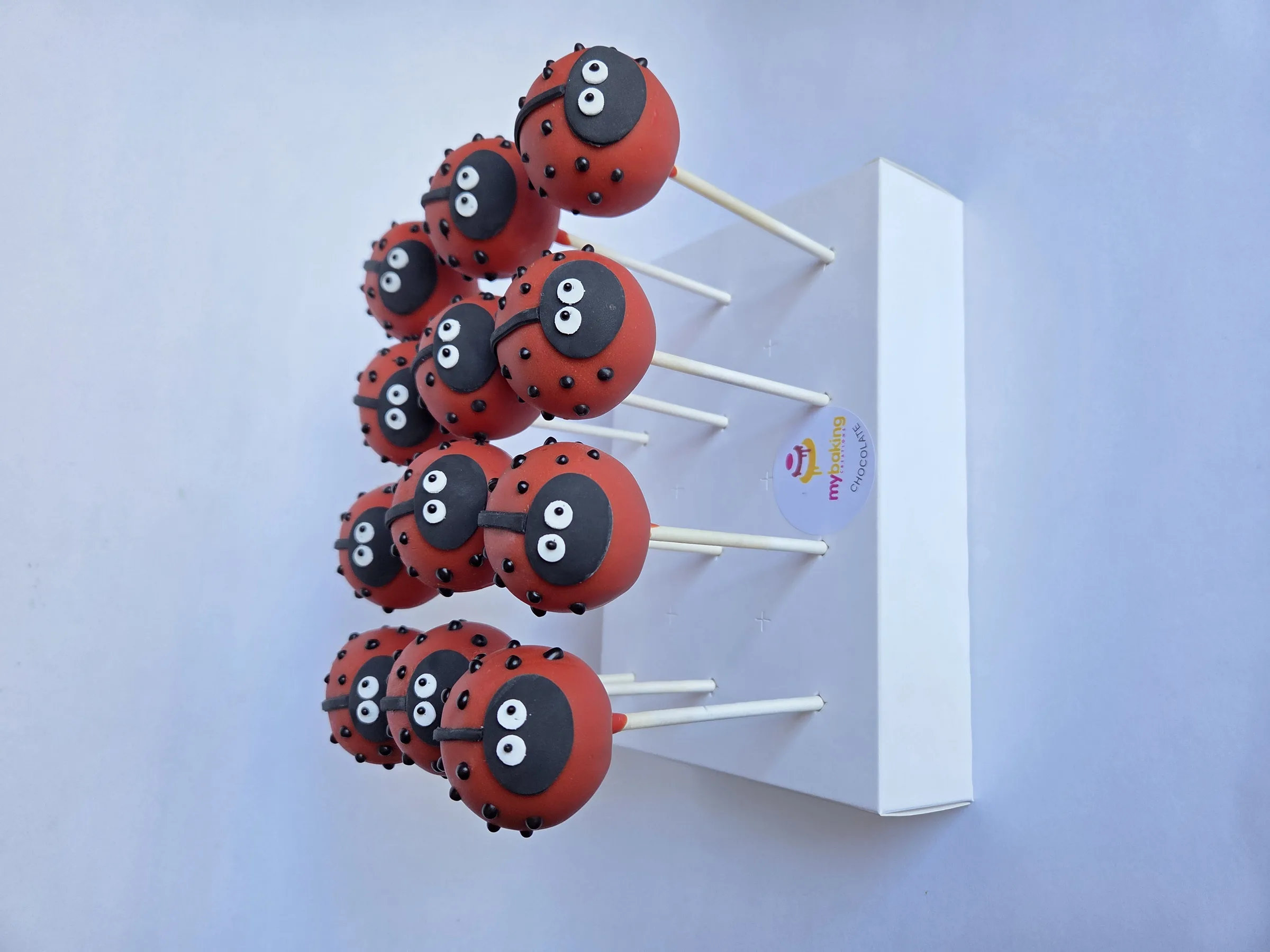 Red ladybug cake pops for a kids birthday party in San Francisco