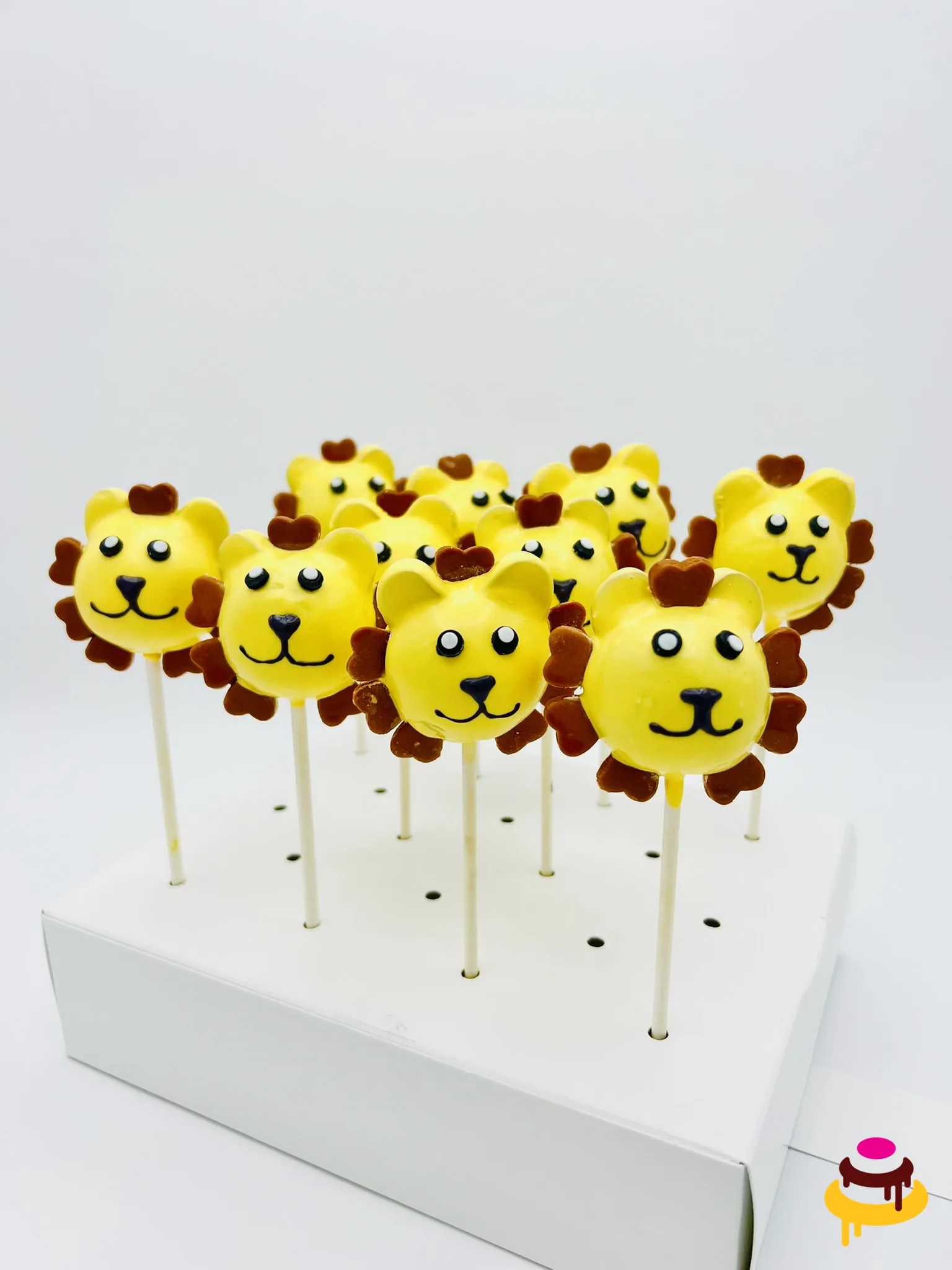 Yellow lion cake pops for a jungle themed party in San Francisco