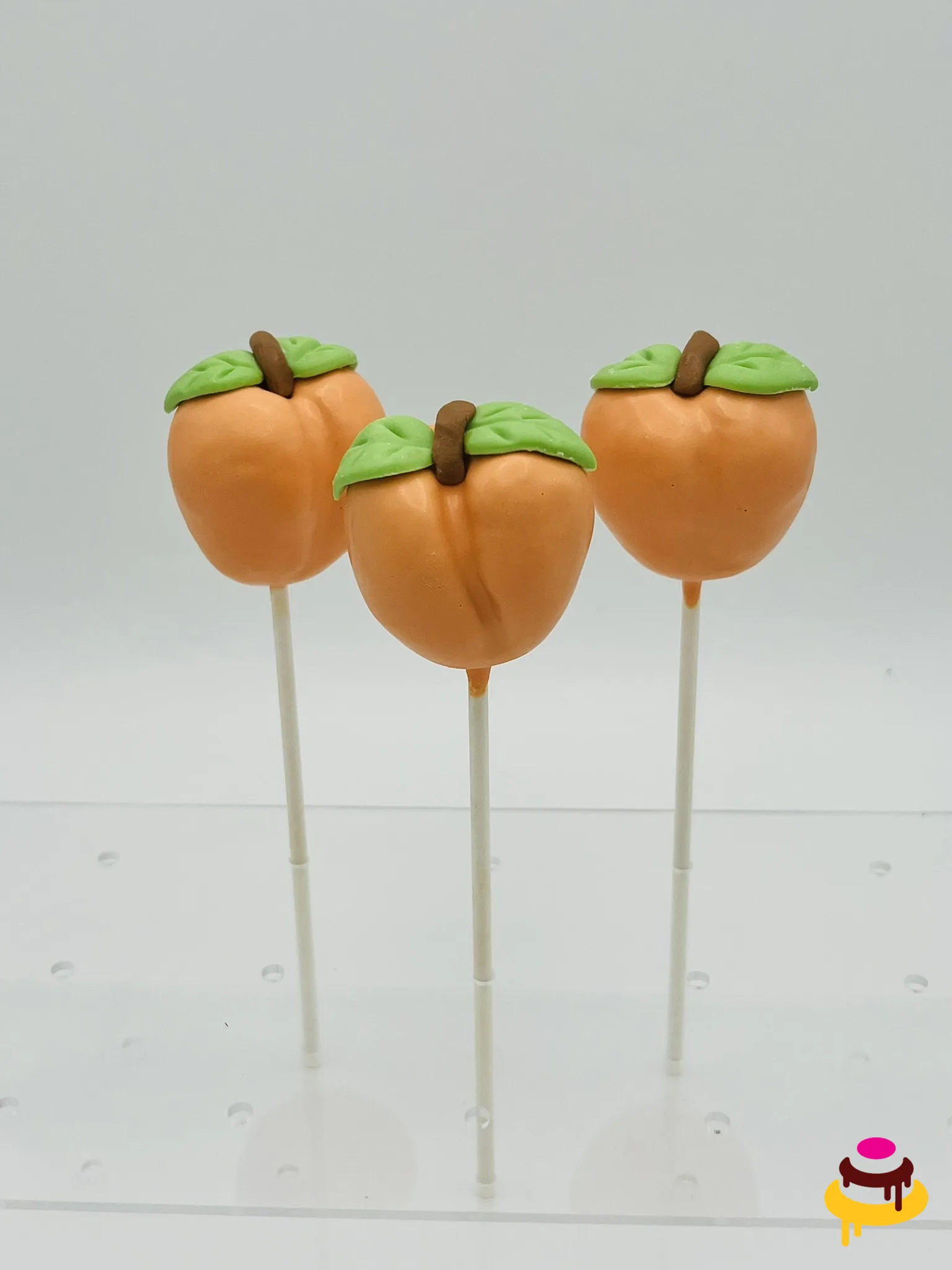Peach shaped cake pops for a summer party in the San Francisco Bay Area
