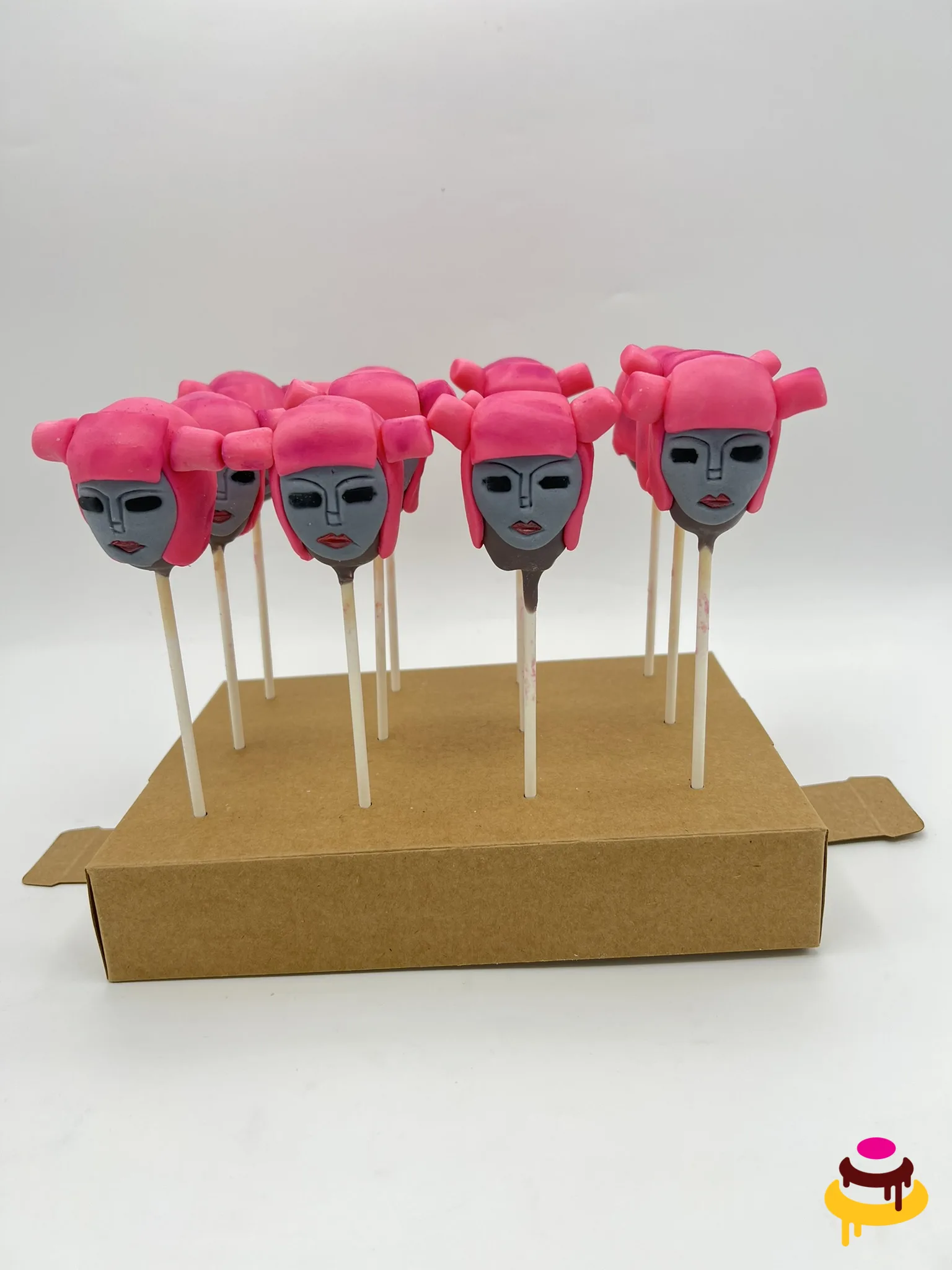 Pink haired character cake pops for a themed birthday party in San Francisco