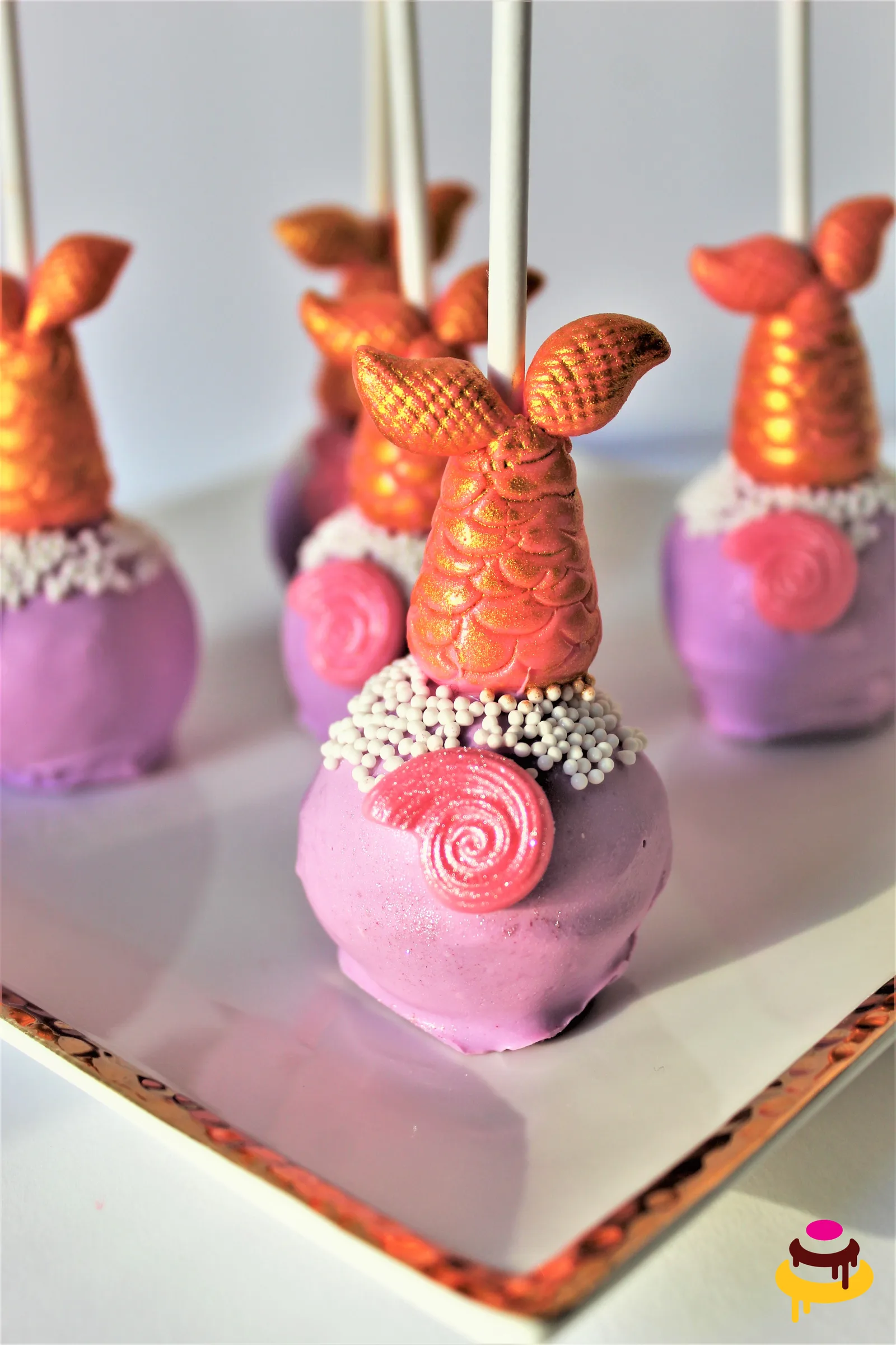 Pink and orange mermaid tail cake pops for a mermaid party in the Bay Area