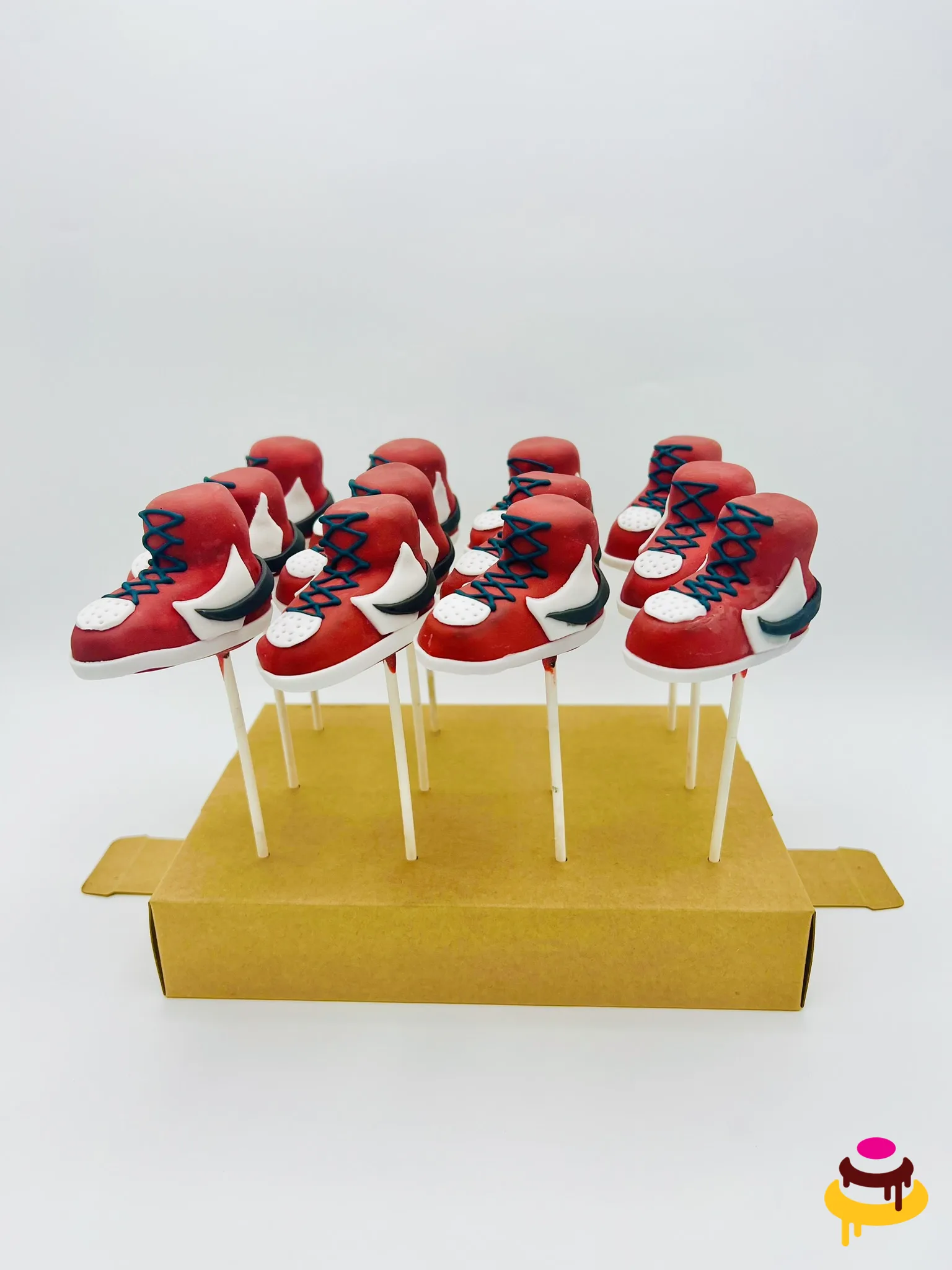 Red and white sneaker cake pops for a sneakerhead party in the Bay Area