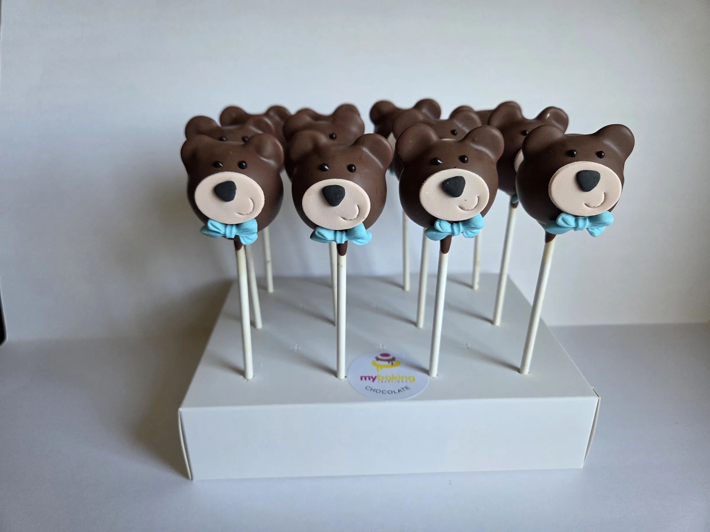 Teddy bear cake pops with blue bow ties for a baby shower in San Francisco