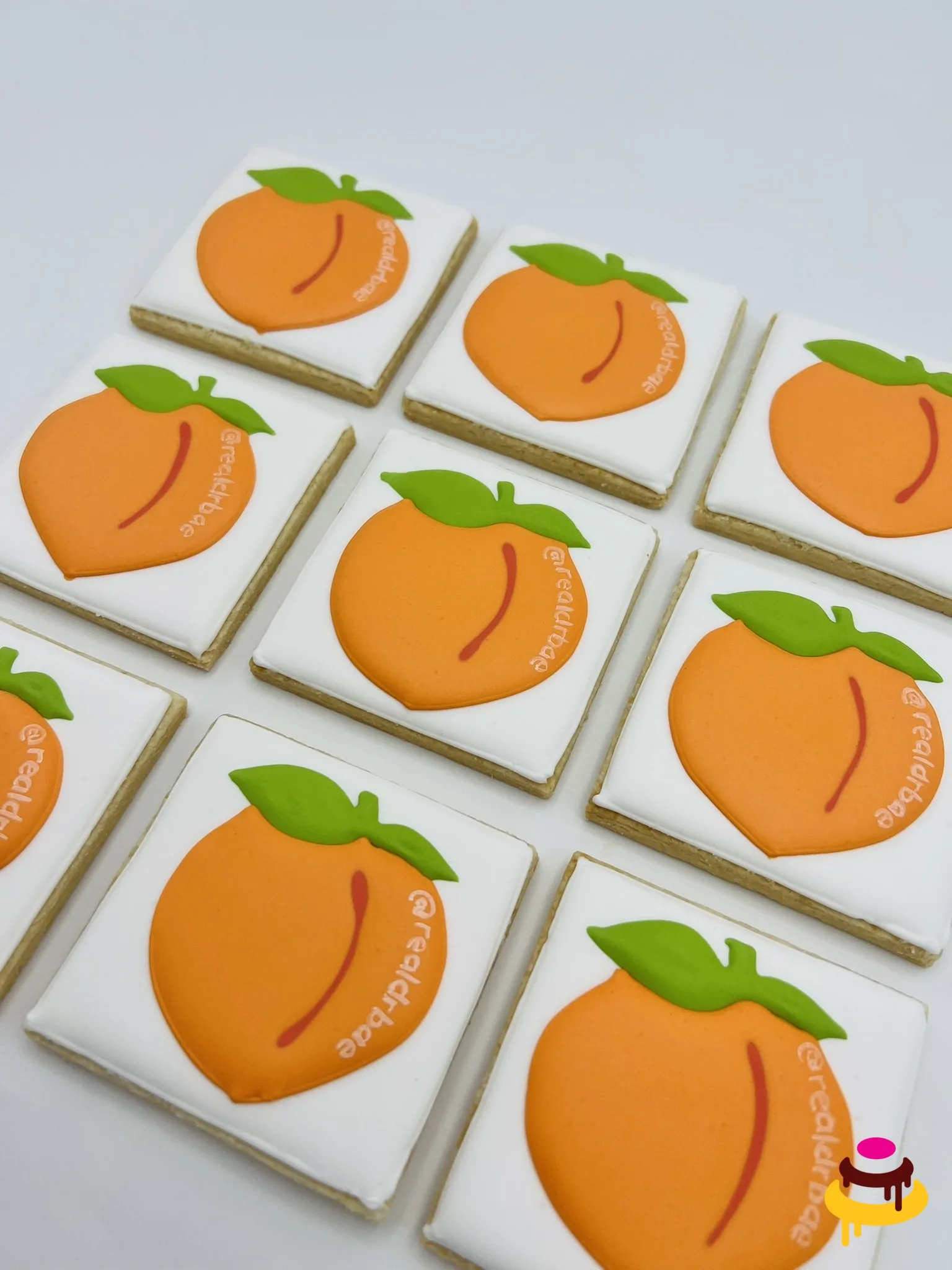 Peach company logo hand piped corporate cookies Bay Area