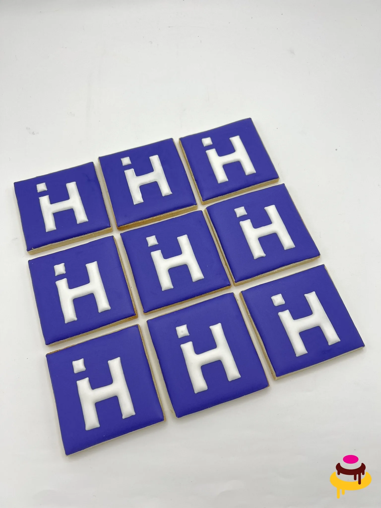 Purple H company logo hand piped corporate cookies San Francisco