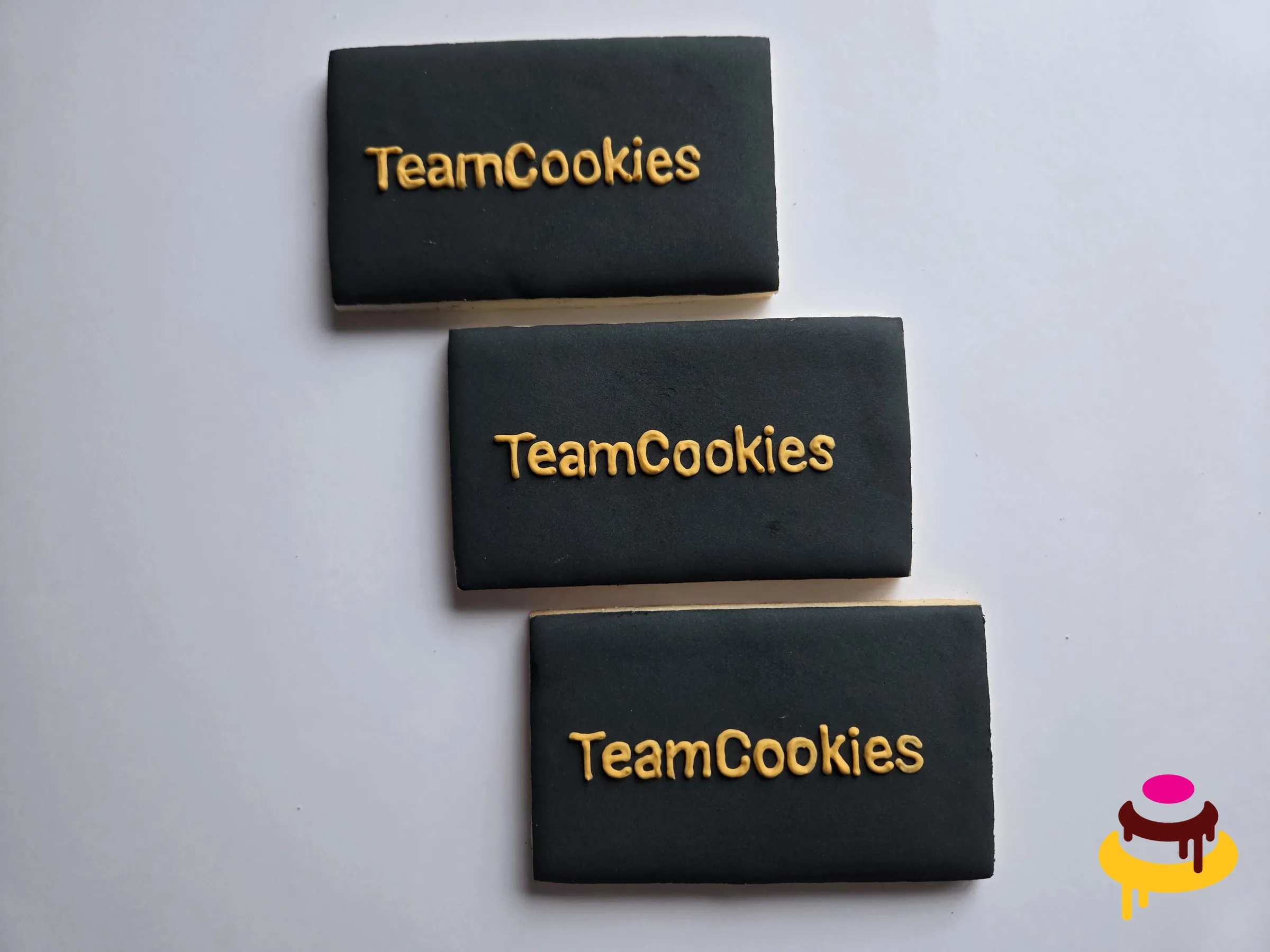 TeamCookies gold logo hand piped corporate cookies San Francisco