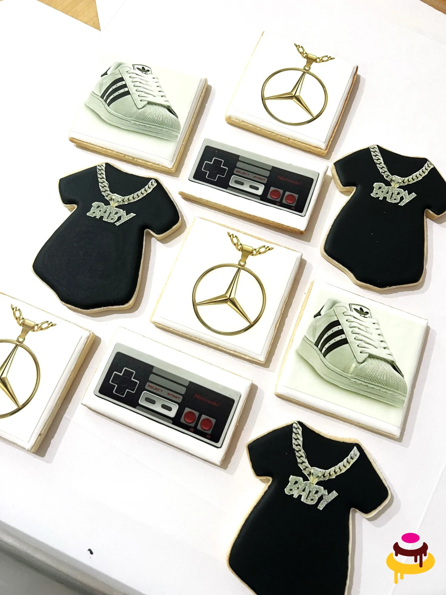 Streetwear themed baby shower cookies with onesies sneakers and gold chains San Francisco
