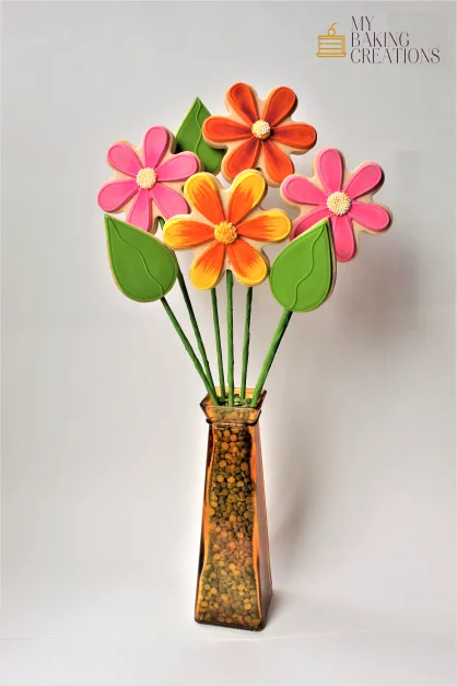 Hand piped flower bouquet cookies on sticks in a vase in the Bay Area