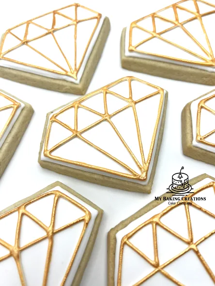 Gold diamond hand piped cookies for a jewelry store in San Francisco